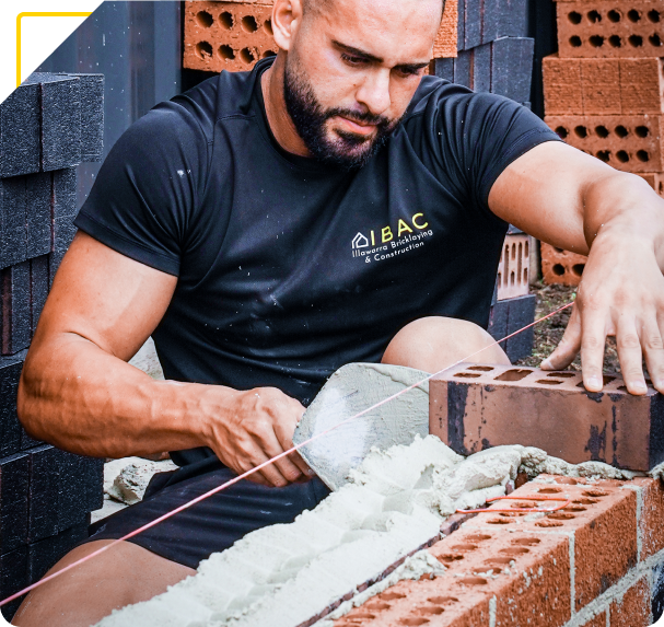 Retaining wall build image showing brick and block construction details up close.